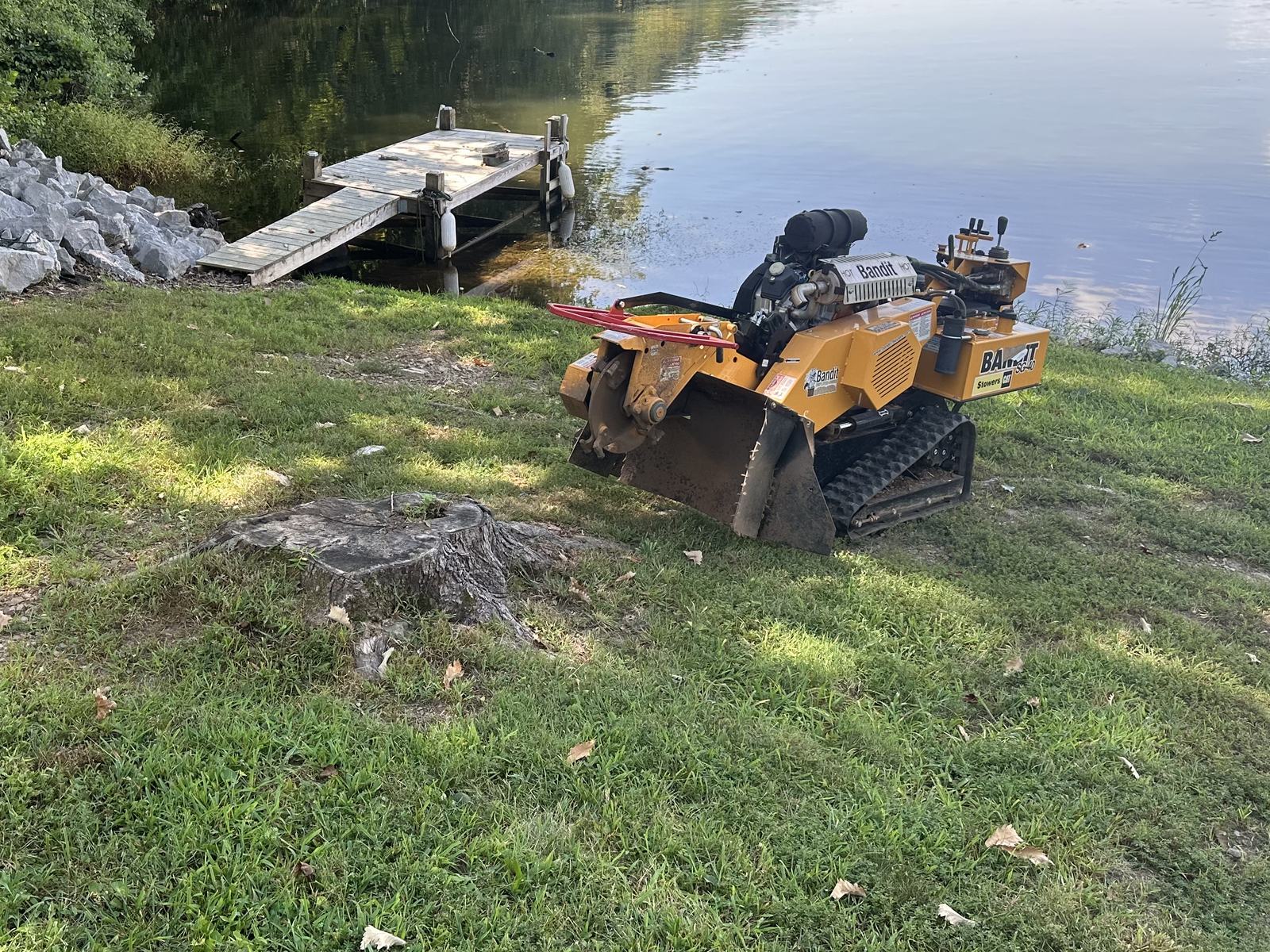 Solaterra LLC stump grinder actively grinding a stump